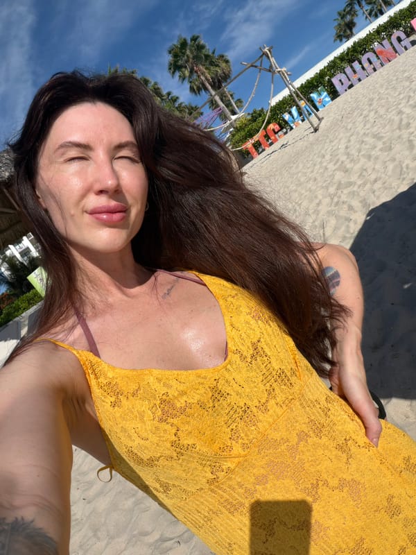 Woman sunbathes on Vietnamese beach during early morning hours