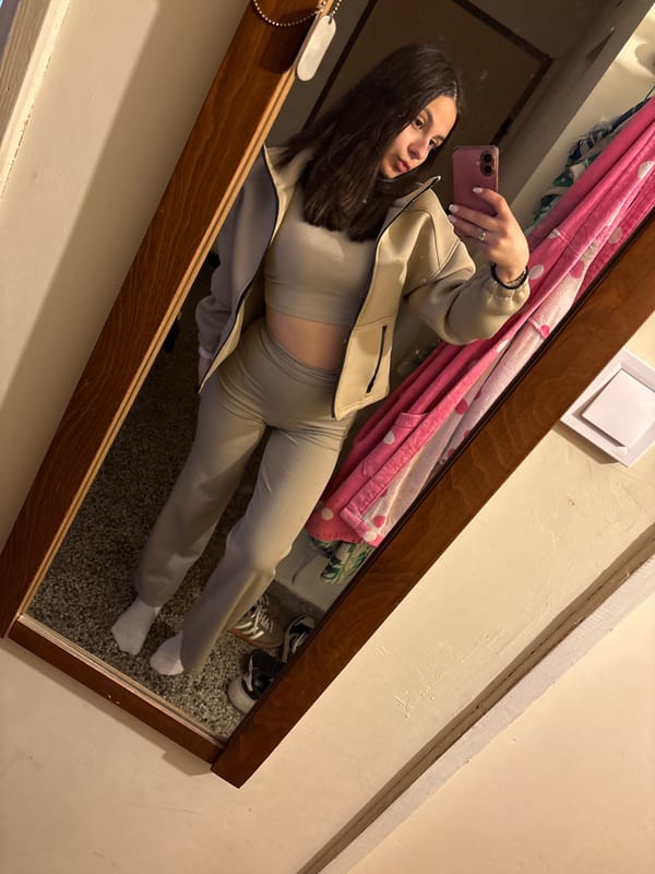Woman takes mirror selfies in beige outfit, Radomir Bulgaria
