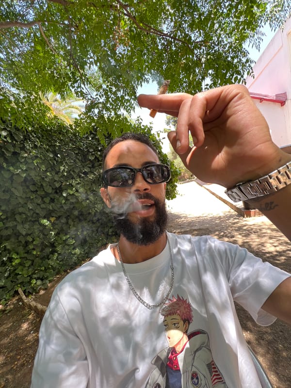 Man photographed smoking in garden setting, Meknes Morocco
