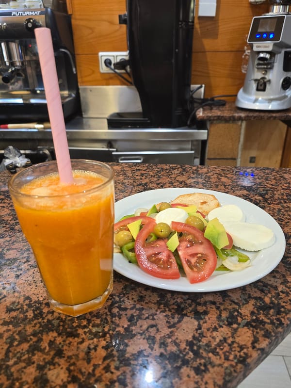 Lunch with orange juice and salad in Barcelona