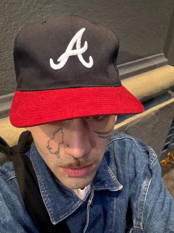 Tattooed individual photographed in Buenos Aires evening scene