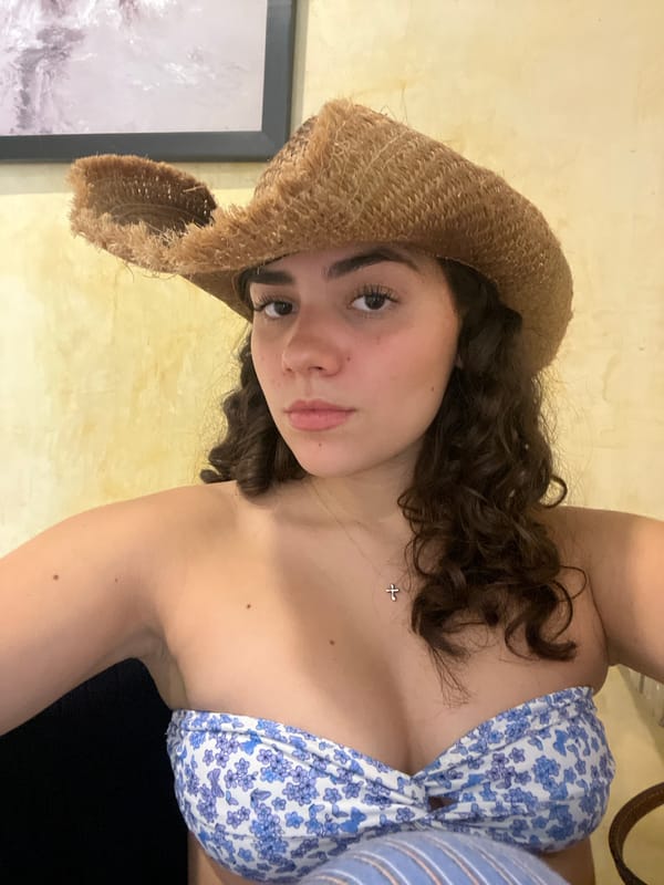 Woman in summer attire reflected in mirror, Brisas de Zicatela