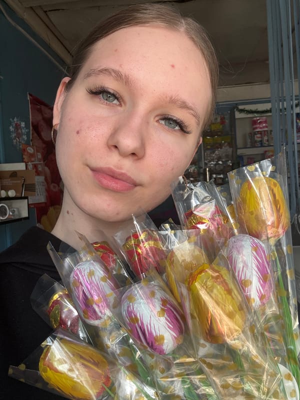Woman receives chocolate tulip bouquet with meal in Rusalevka