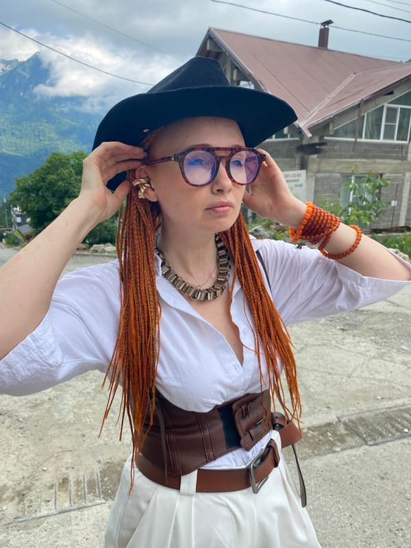 Bold fashion shoot on a sloped road in Krasnaya Polyana