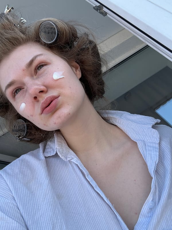 Woman takes selfies during morning beauty routine in Kazan