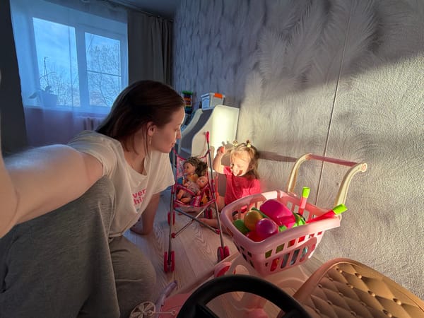 Mother and daughter enjoy toy playtime in Reshetnikovo home