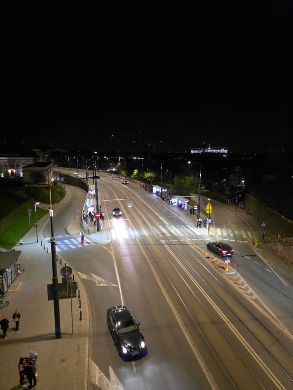 Nighttime tour through illuminated Warsaw Old Town landmarks documented