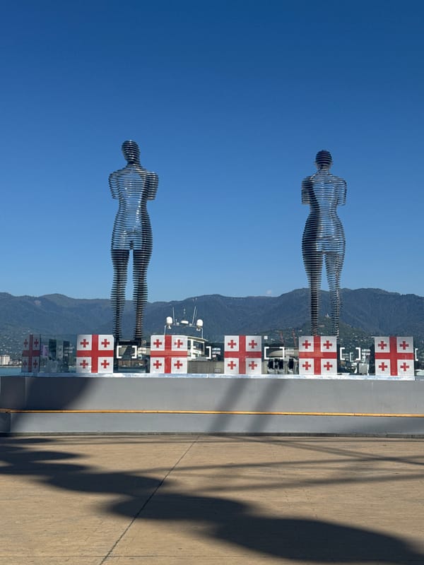 Tourist documents Batumi Boulevard landmarks during seven-minute walking tour