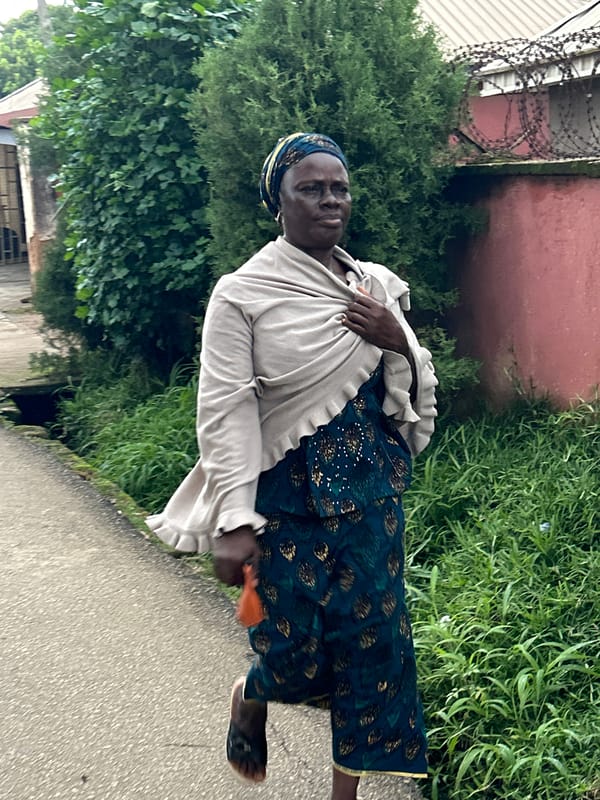 Church gathering and street life intersect on a Jos morning