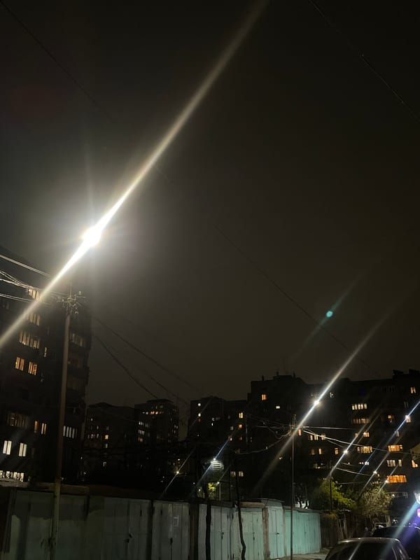 Evening lights illuminate Yerevan residential buildings and streets
