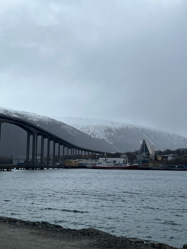 Overcast day captured around Tromsø Bridge and city waterfront