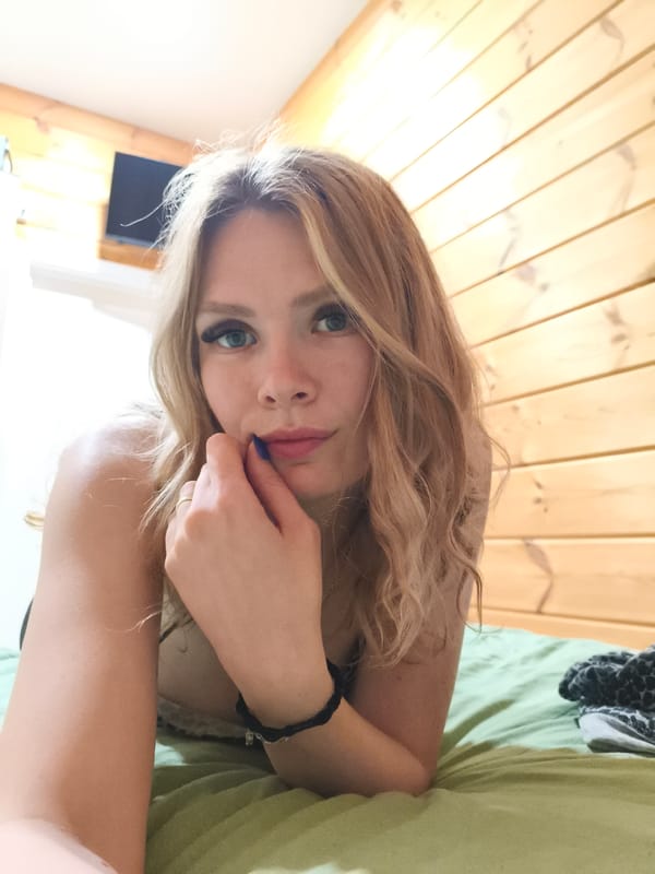 Woman photographs herself in leopard print in Russian village