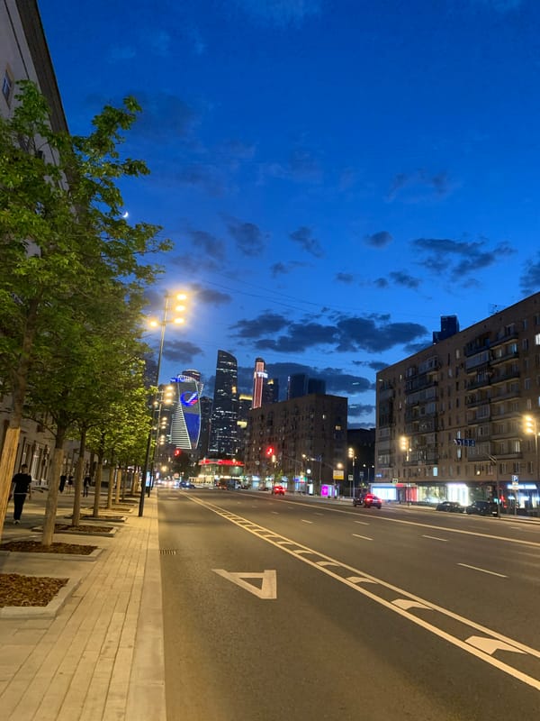 Evening street scene documented during dusk-to-night transition