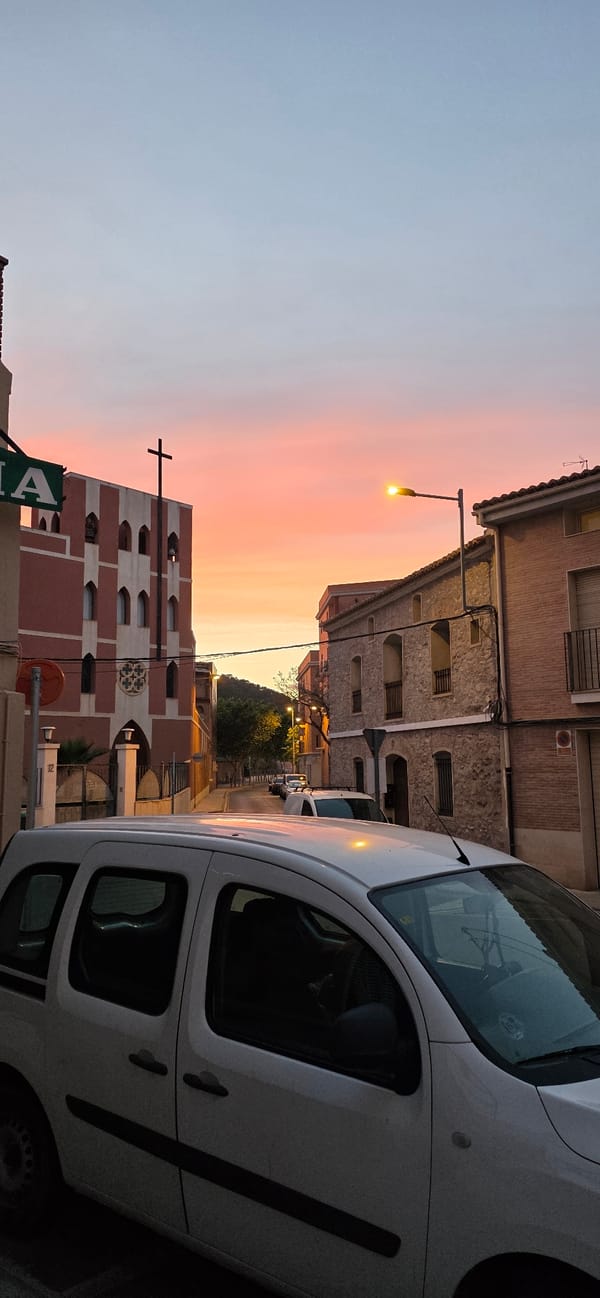 Vibrant sunset colors observed over Sagunto street