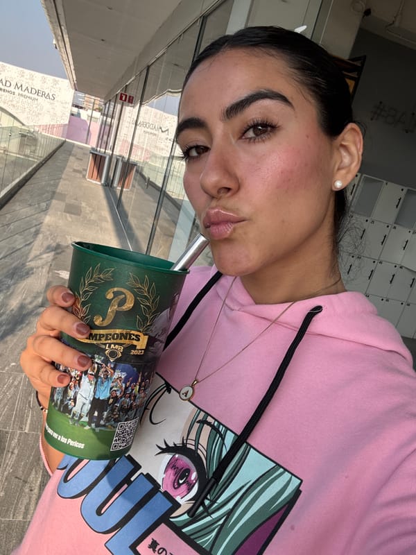 Woman displays Pericos championship cup in Puebla selfie
