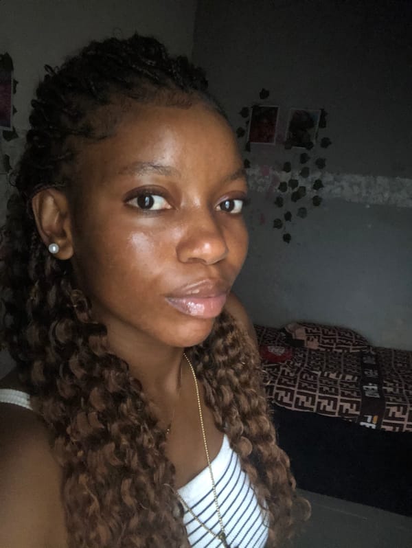 Young woman poses for indoor portrait session in Nigeria