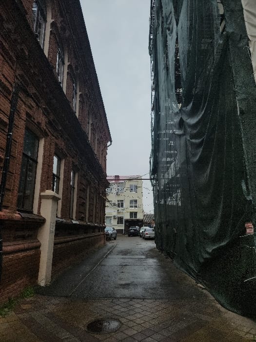 Morning street photography documentation across central Krasnodar under overcast skies