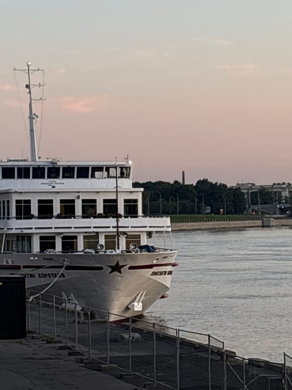 Bicycle ride and docked ship along the Neva at twilight