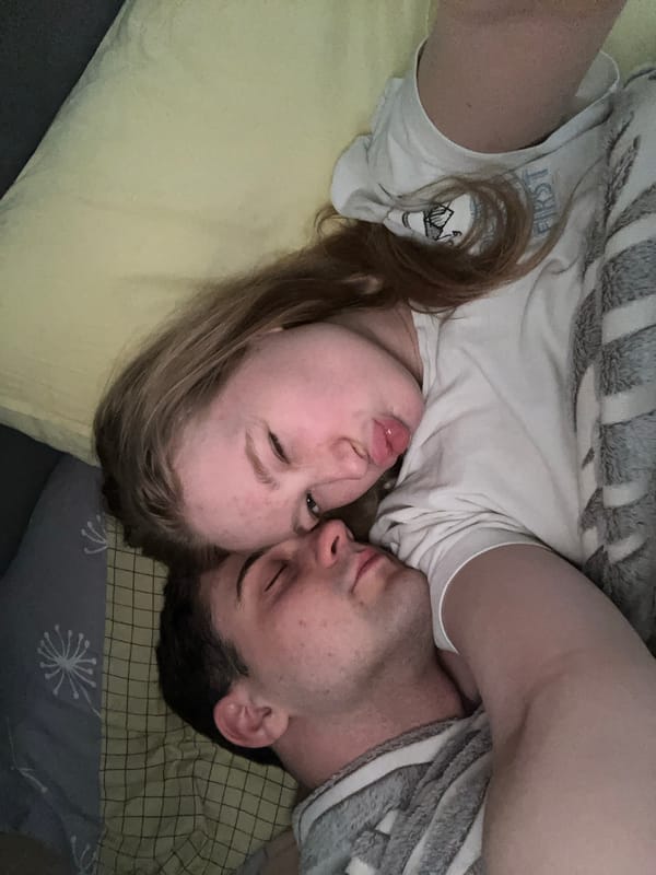 Intimate moment captured between couple in Yuzhny bedroom