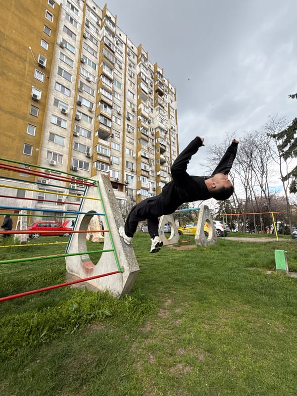 Person performs parkour jumps on playground structure in Shumen