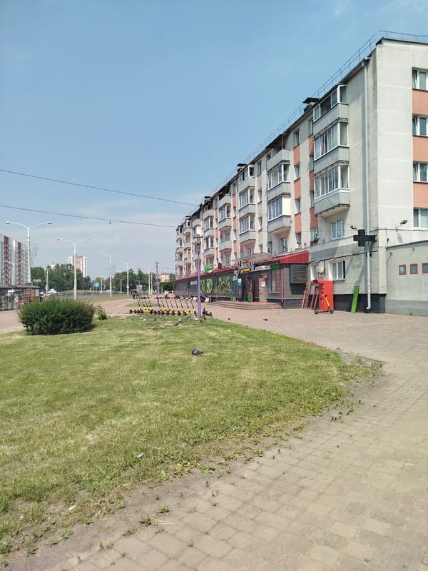 Minsk neighborhood: scooters, street murals, and a courtyard playground