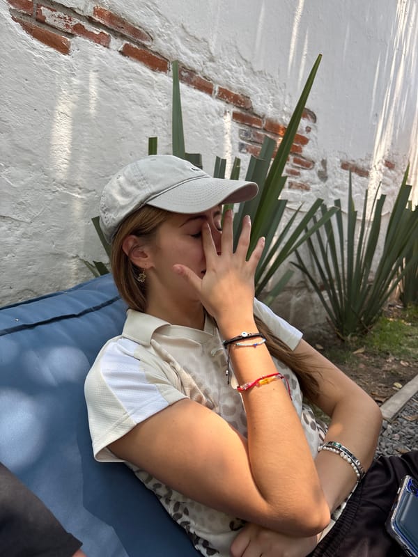 Woman rests near romantic garden wall in Cholula