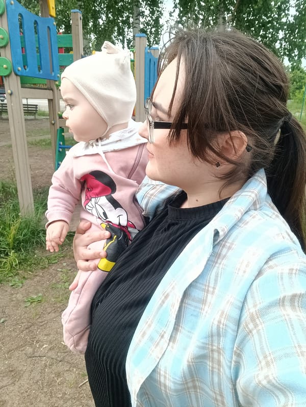 Summer day activities documented in Chaikovsky, Russia playground and pool