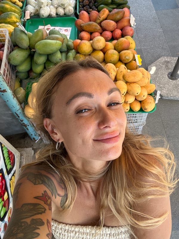 Tourist documents fruit market visit in Vietnam