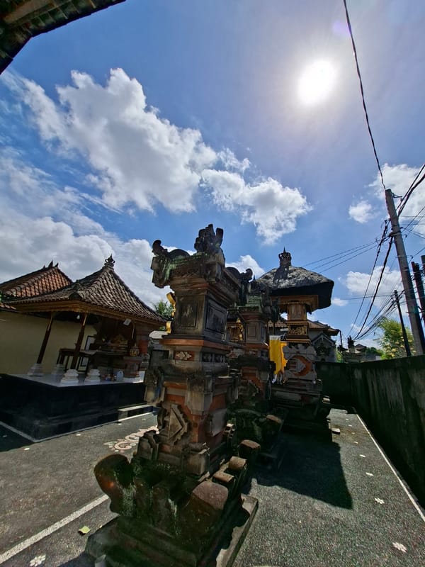 Tourist documents Balinese temple complex and village scenes in Blahbatuh