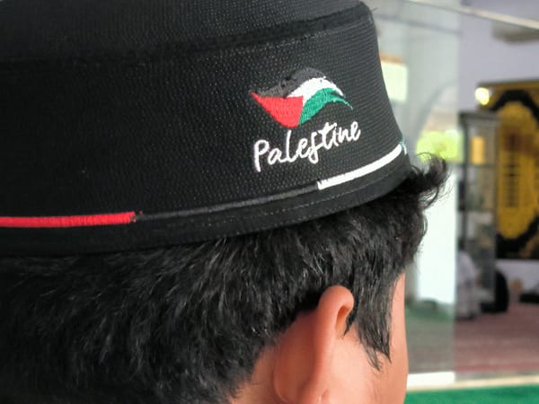 Morning life captured in Lhokseumawe with Palestinian solidarity displays