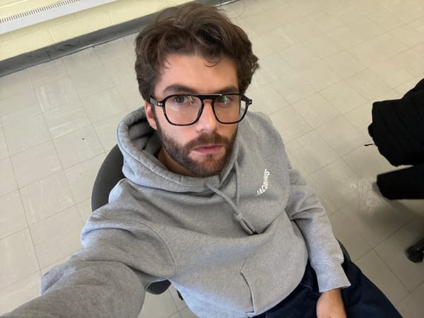 Montreal resident captures multiple selfies in grey hoodie
