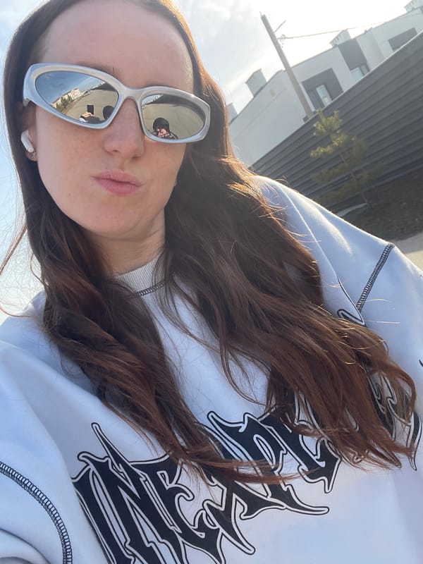 Woman takes playful selfies outdoors in Russian town