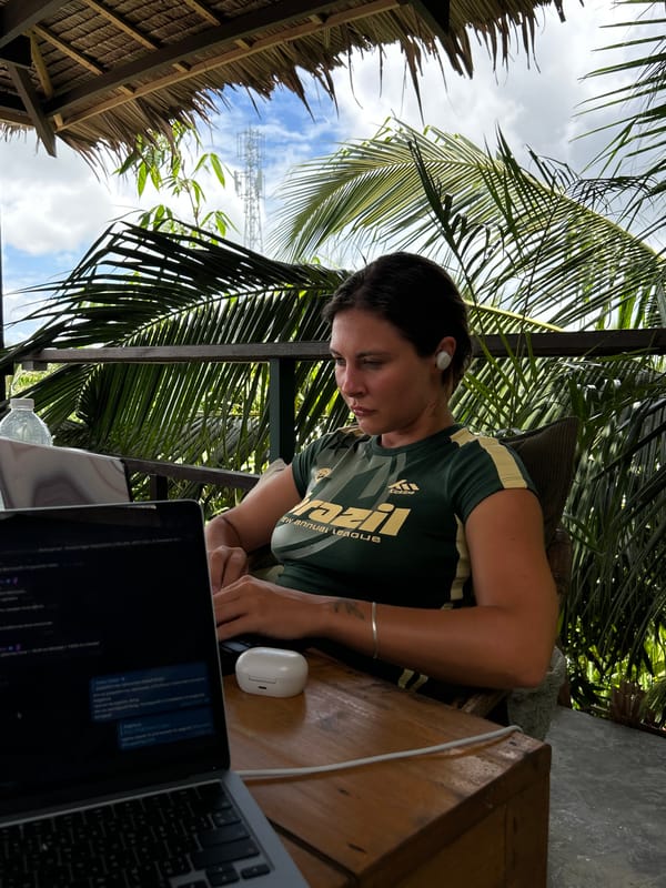 Woman works on laptop at Philippine cafe during early morning