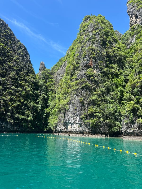 Towering limestone karsts off the coast of Haad Yao, Thailand