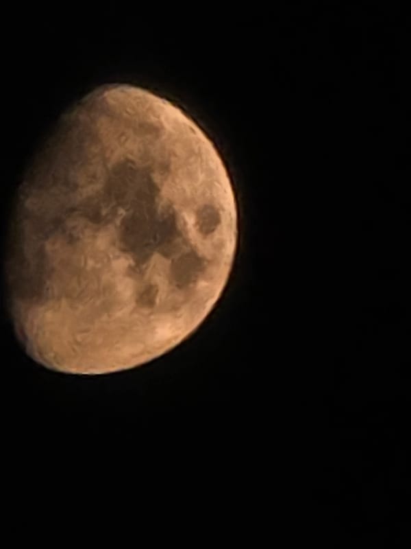 Close-up shots of a gibbous moon, craters visible