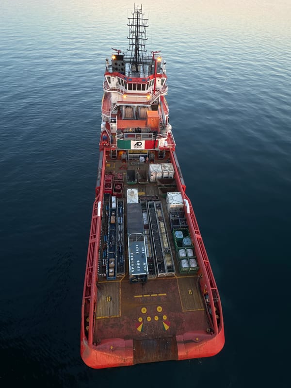 Offshore support vessel works alongside oil rig, Adriatic Sea