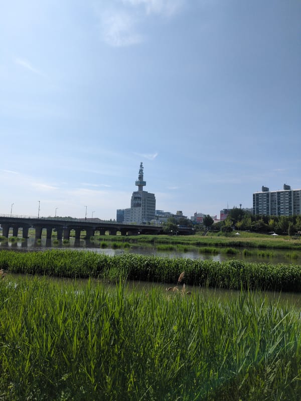Tourist documents Daejeon landmarks during early morning walkthrough