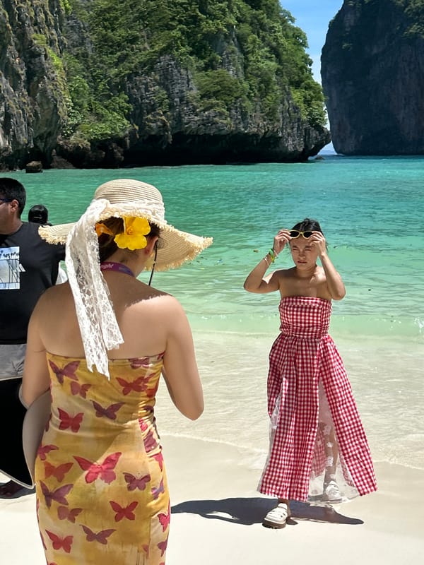 Tourists enjoy scenic morning at Maya Bay, Thailand