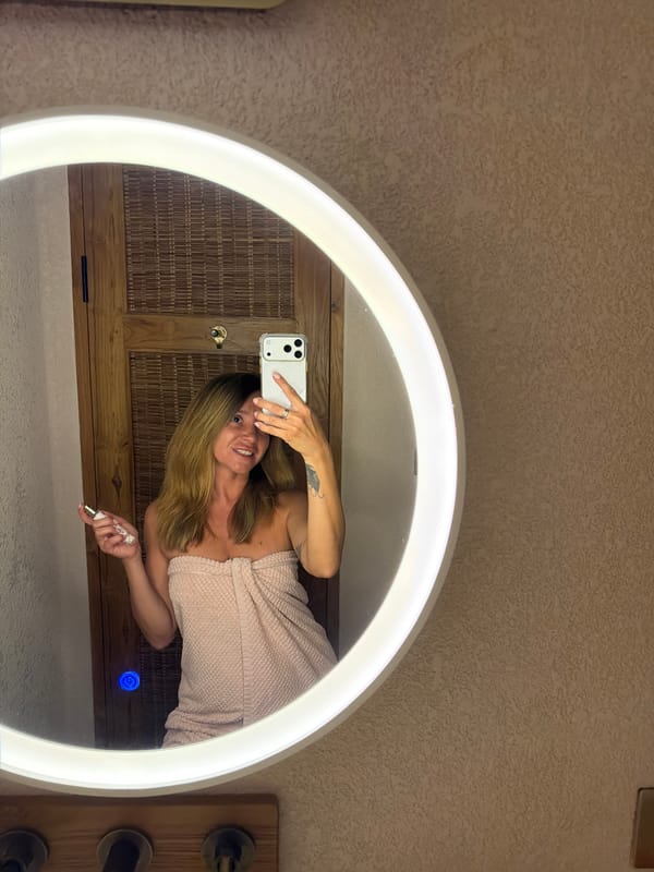 Woman documents skincare routine selfies in Mengwi bathroom