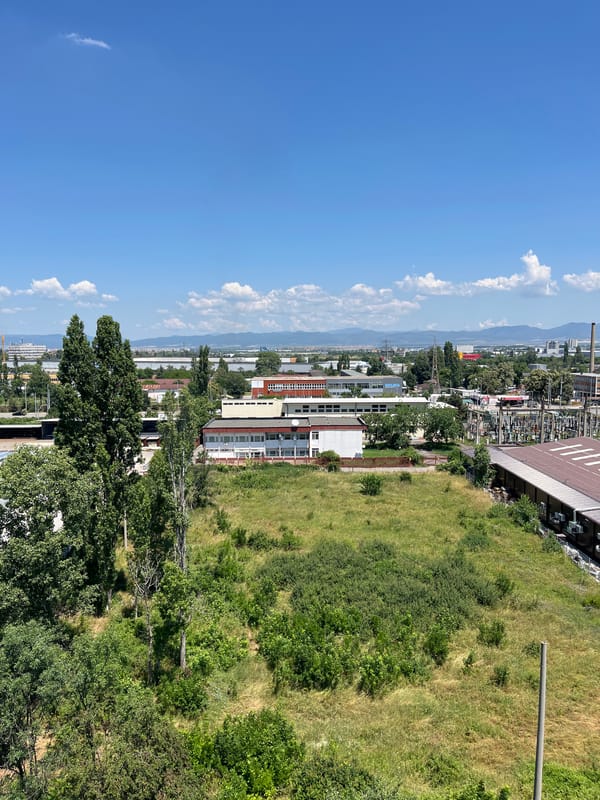 Aerial and hillside views across Sofia's urban-industrial edge