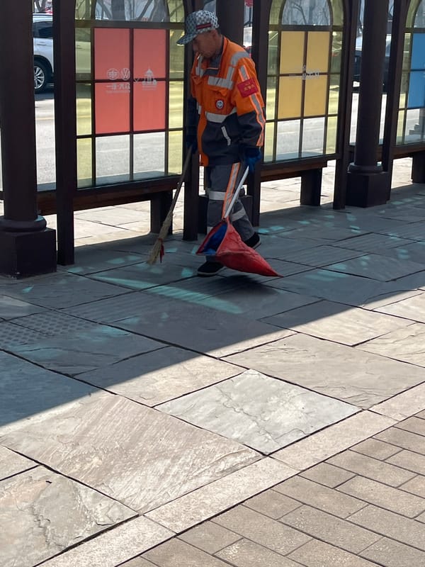 Workers and pedestrians observed at Changchun bus stop