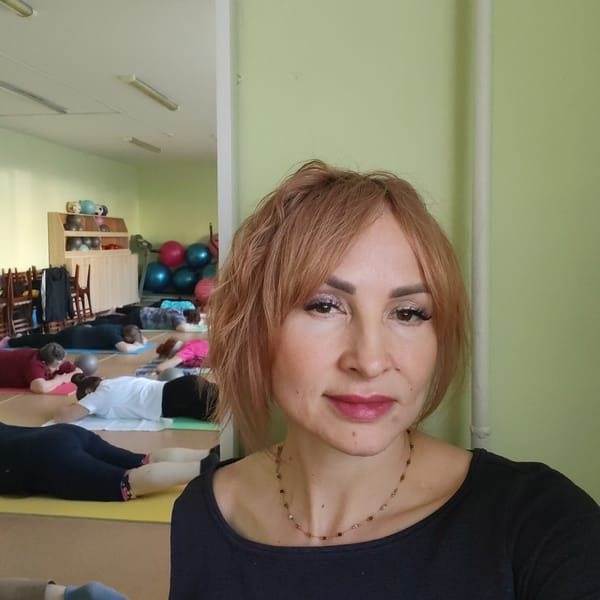Women photograph themselves in early morning indoor sessions
