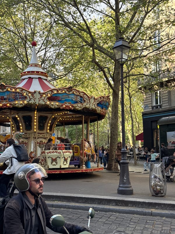 Afternoon street life documented across central Paris neighborhood