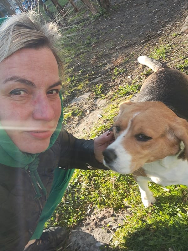 Woman poses with beagle in outdoor selfie in Elektrostal