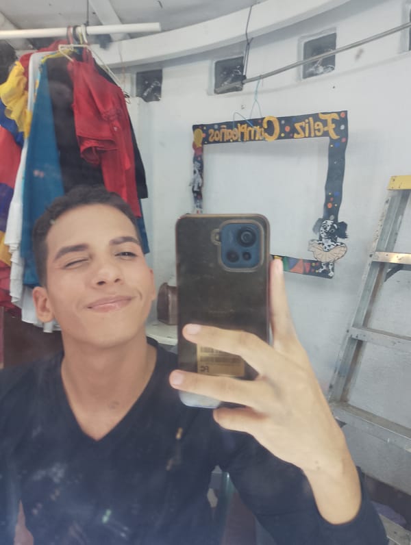 Young man takes multiple selfies in Porlamar bedroom