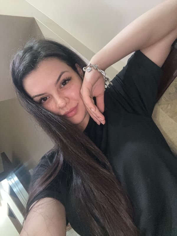 Woman takes multiple selfies indoors in Sliven, Bulgaria