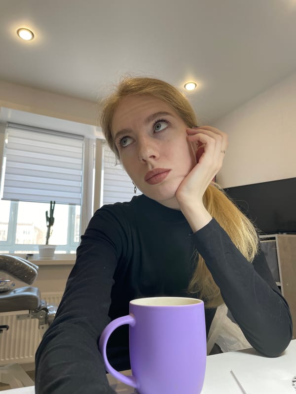 Woman poses for photos with purple mug in Izhevsk