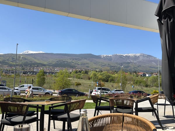 Morning cafe scene captured with mountain views in Sofia