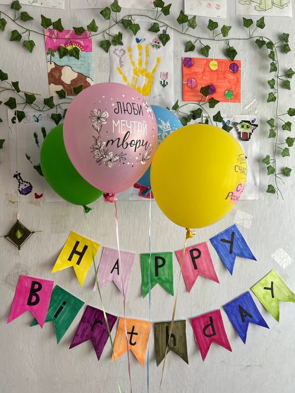 Morning birthday celebration captured in Kerch home with flowers, artwork
