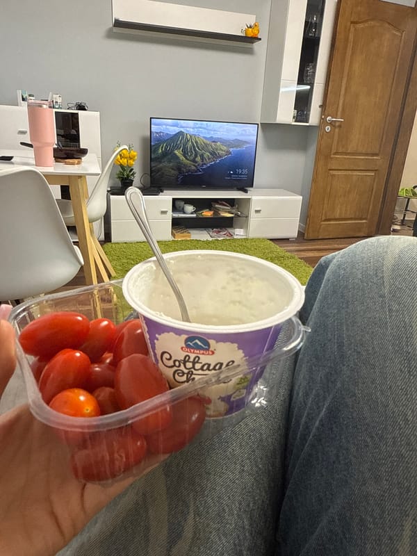 Person enjoys cottage cheese and tomatoes snack in Sofia